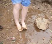 Child's feet in mud